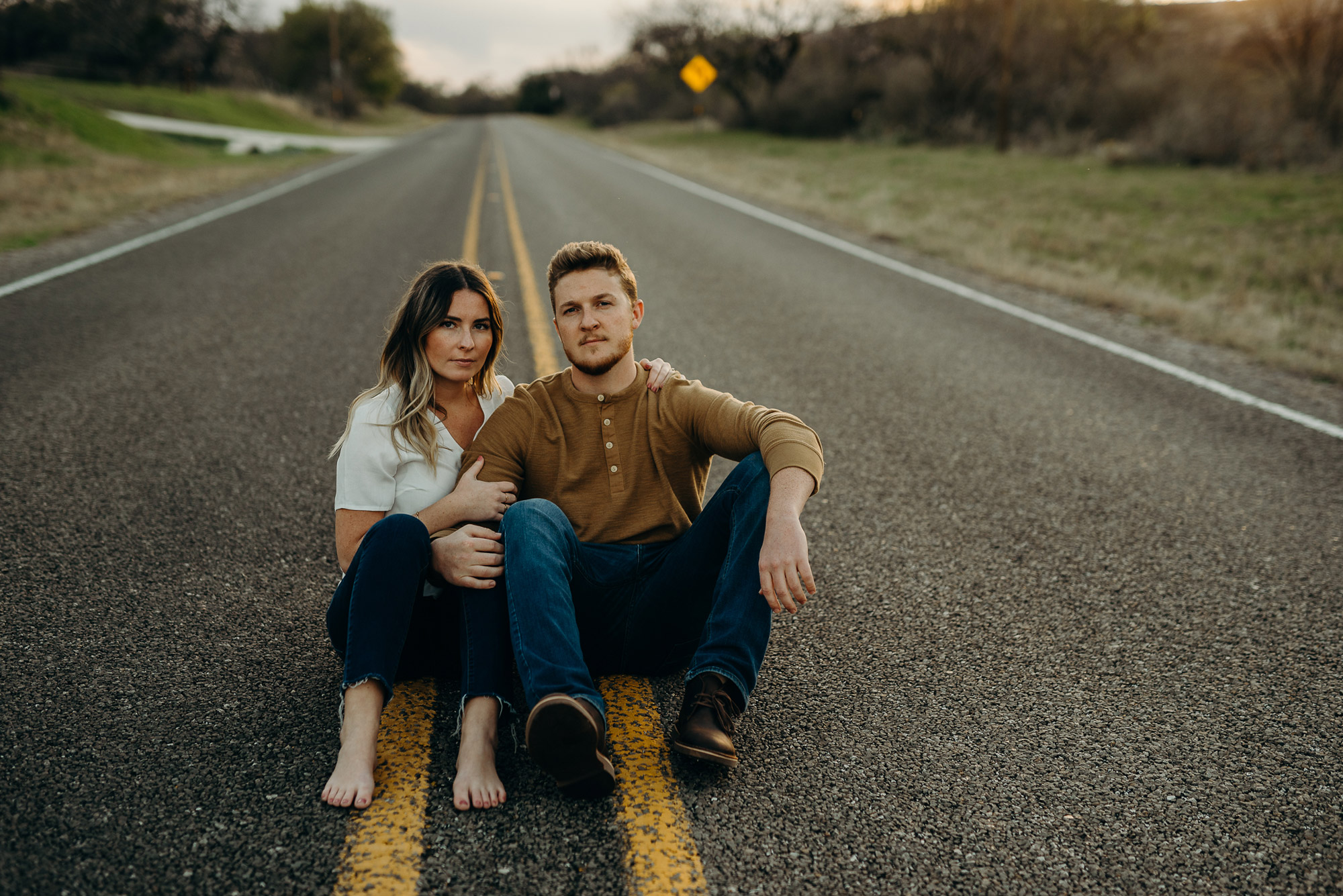 engagement photo couple in the middle of road